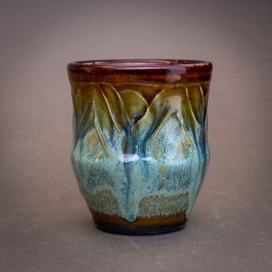 a small cup with a blue, shifting color